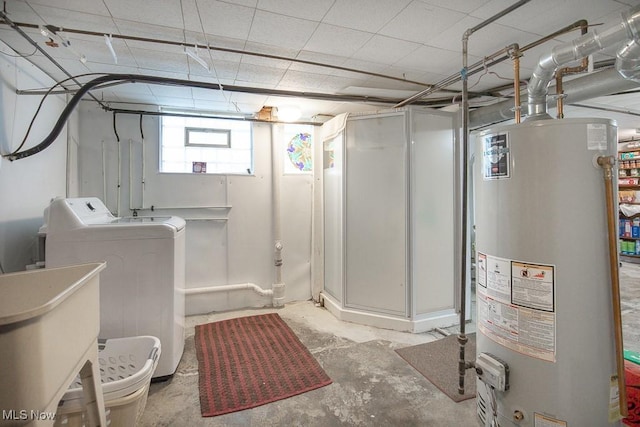 below grade area with gas water heater and washer / clothes dryer
