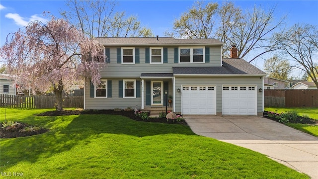 view of front of house with a front yard, fence, driveway, and a chimney