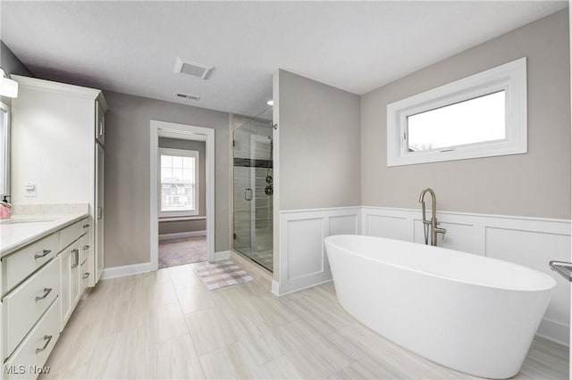 2716 Rocky Ridge Dr, Westlake, OH 44145 - full bath with a stall shower, a freestanding bath, vanity, and visible vents