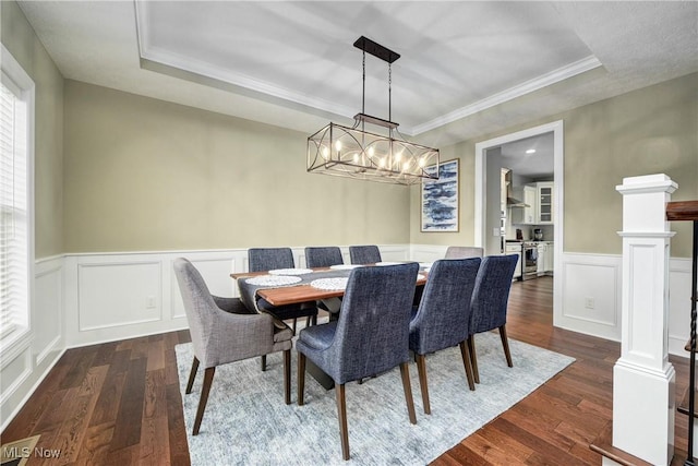 2716 Rocky Ridge Dr, Westlake, OH 44145 - dining area featuring a wainscoted wall, dark wood-type flooring, and a decorative wall
