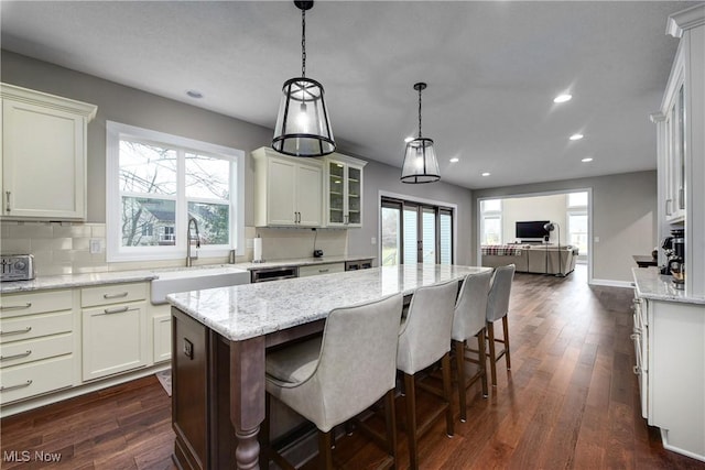 2716 Rocky Ridge Dr, Westlake, OH 44145 - kitchen with recessed lighting, dark wood finished floors, open floor plan, and a sink