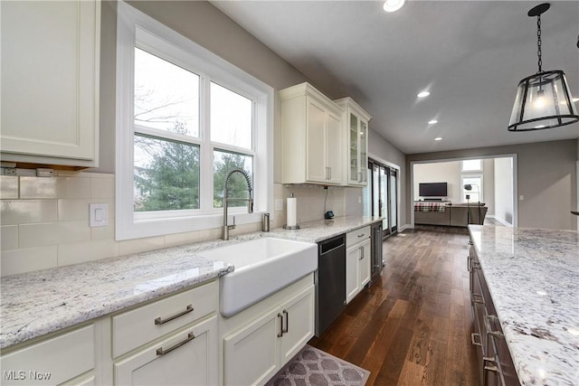 2716 Rocky Ridge Dr, Westlake, OH 44145 - kitchen with recessed lighting, stainless steel dishwasher, plenty of natural light, a sink, and decorative backsplash