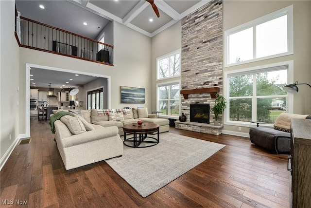 2716 Rocky Ridge Dr, Westlake, OH 44145 - living area featuring baseboards, ceiling fan, a towering ceiling, and dark wood-type flooring