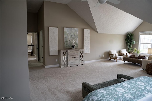 bedroom with carpet floors, baseboards, and lofted ceiling