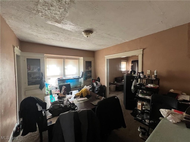office featuring carpet flooring and a textured ceiling