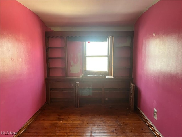 empty room with wood-type flooring