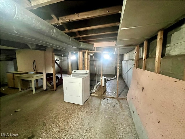 unfinished basement with washer / dryer