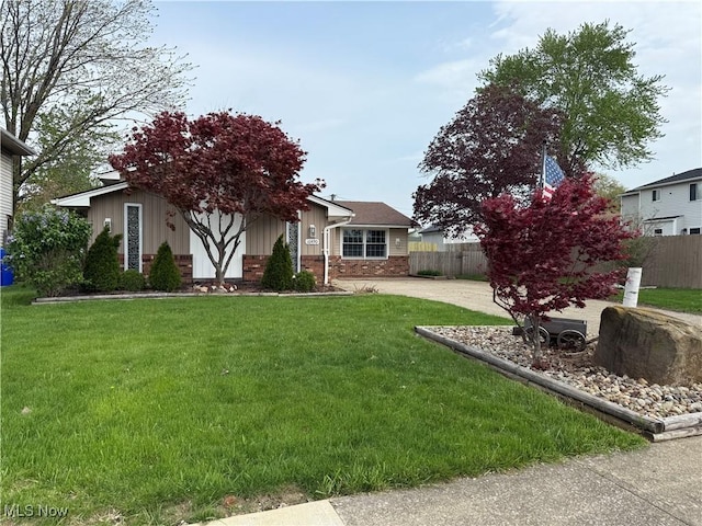 exterior space featuring concrete driveway and fence