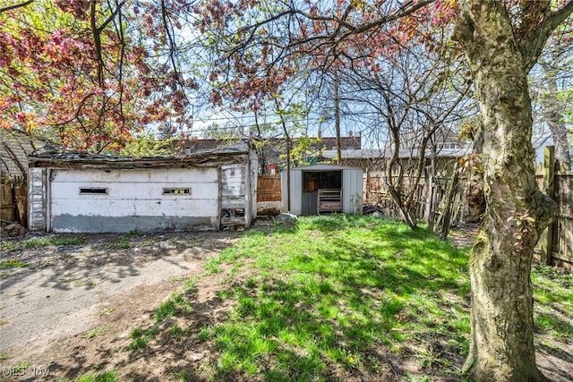 exterior space featuring an outdoor structure and fence