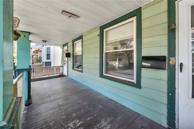 wooden deck featuring a porch