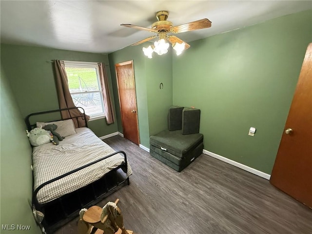 bedroom with baseboards, a ceiling fan, and wood finished floors