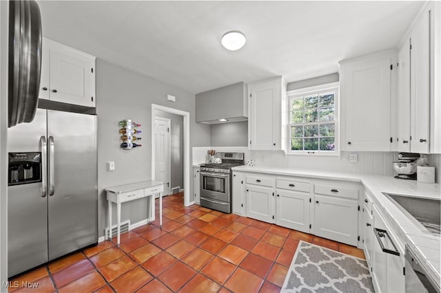 kitchen with visible vents, white cabinetry, tile patterned floors, and stainless steel appliances