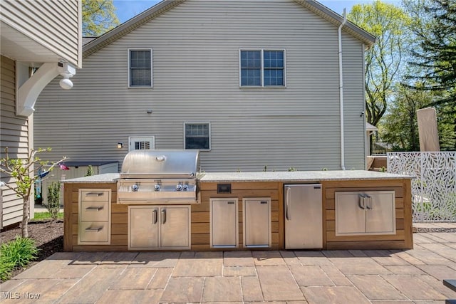 view of patio / terrace with grilling area and exterior kitchen