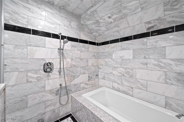 full bath featuring tiled shower and a tub to relax in