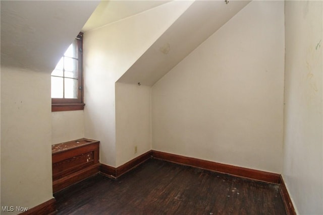 132 Jennette Dr, Boardman, OH 44512 - additional living space featuring baseboards, vaulted ceiling, and wood finished floors