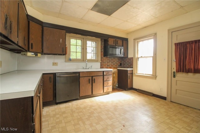 132 Jennette Dr, Boardman, OH 44512 - kitchen with a sink, light countertops, a paneled ceiling, stainless steel appliances, and light floors