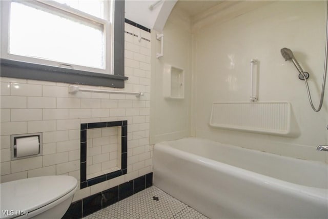132 Jennette Dr, Boardman, OH 44512 - bathroom with  shower combination, tile patterned floors, toilet, and tile walls