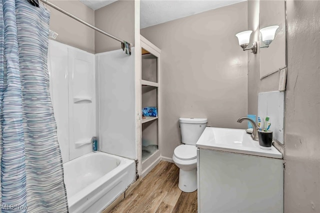full bath with toilet, shower / bath combination with curtain, wood finished floors, and vanity