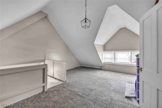 bonus room with carpet floors and lofted ceiling