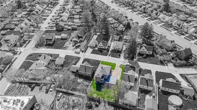 birds eye view of property with a residential view