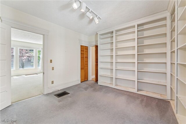 162 S Cedar St, Oberlin, OH 44074 - unfurnished room featuring carpet flooring and rail lighting