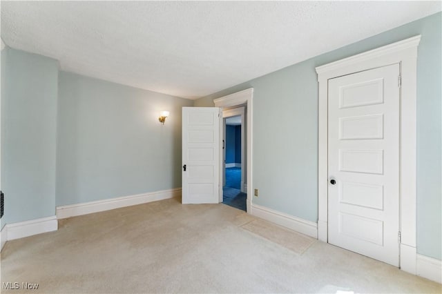 162 S Cedar St, Oberlin, OH 44074 - carpeted spare room featuring baseboards and a textured ceiling