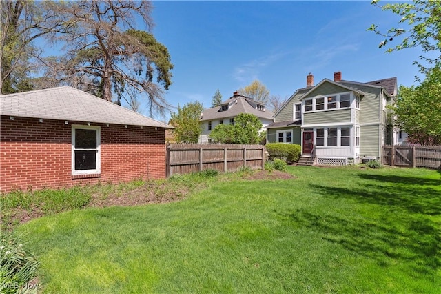 162 S Cedar St, Oberlin, OH 44074 - back of property with a chimney and brick siding