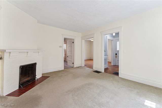 162 S Cedar St, Oberlin, OH 44074 - unfurnished living room featuring carpet floors, a fireplace, and baseboards