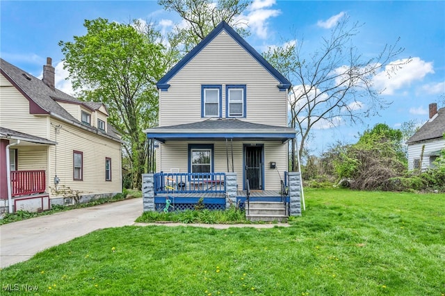view of front facade with a porch and a front lawn