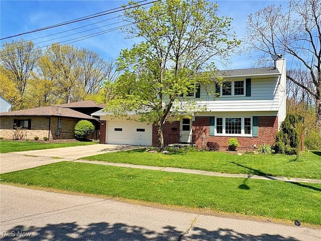 traditional-style house with brick siding, driveway, a chimney, and a garage