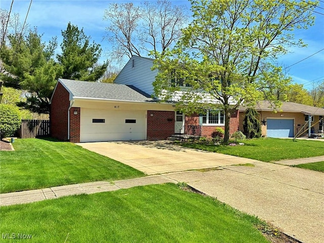 view of front of home featuring fence, an attached garage, brick siding, a front yard, and driveway