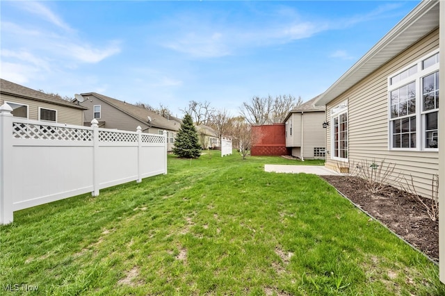 view of yard with fence and a patio area