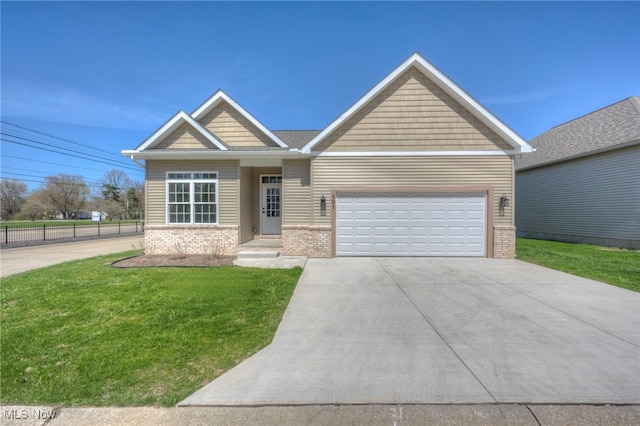 craftsman inspired home with concrete driveway, brick siding, a front yard, and a garage