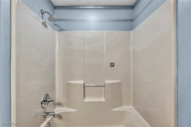 bathroom with shower / bathtub combination