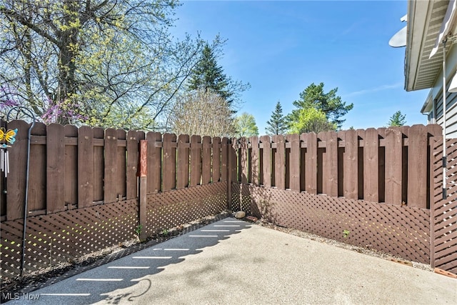 view of patio featuring fence