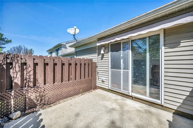 view of patio / terrace featuring fence