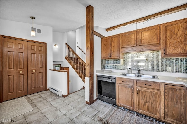 kitchen featuring backsplash, visible vents, a sink, a baseboard heating unit, and black dishwasher