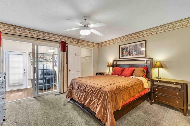 bedroom with carpet flooring, a ceiling fan, and access to exterior