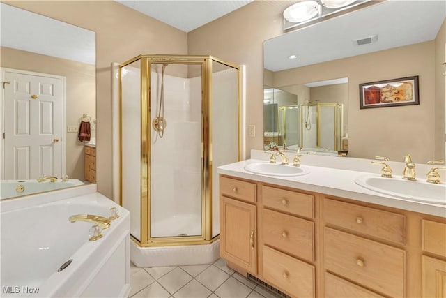 full bathroom with visible vents, a sink, a bath, and a stall shower