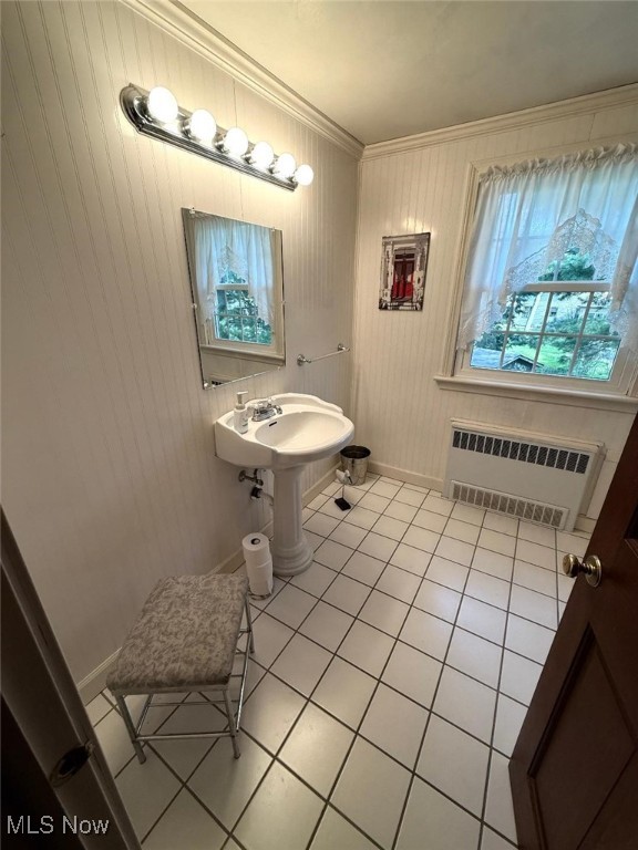 422 Glenwoods Ct, Boardman, OH 44512 - bathroom with radiator heating unit, tile patterned flooring, baseboards, crown molding, and a sink