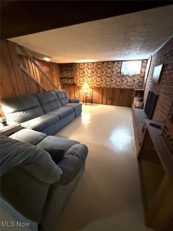422 Glenwoods Ct, Boardman, OH 44512 - living room with wooden walls, stairway, and concrete floors