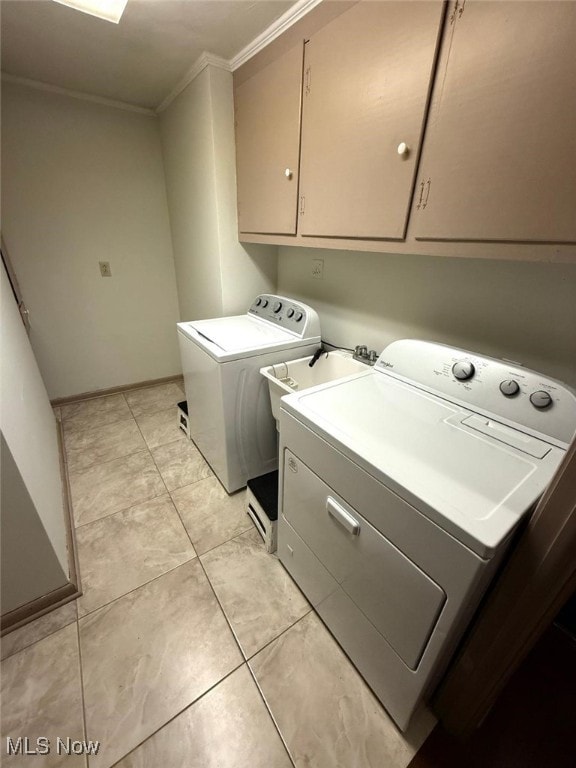 422 Glenwoods Ct, Boardman, OH 44512 - washroom with cabinet space, washer and dryer, ornamental molding, light tile patterned floors, and baseboards