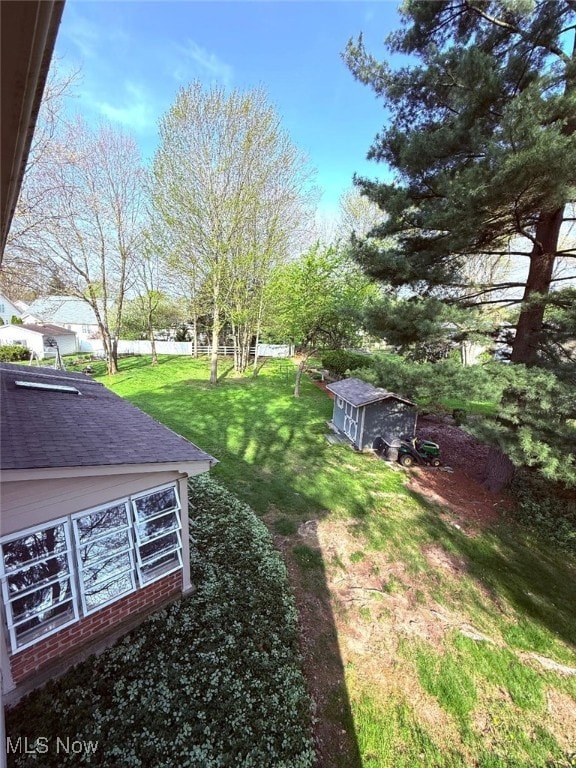 422 Glenwoods Ct, Boardman, OH 44512 - view of green lawn featuring a shed and an outdoor structure