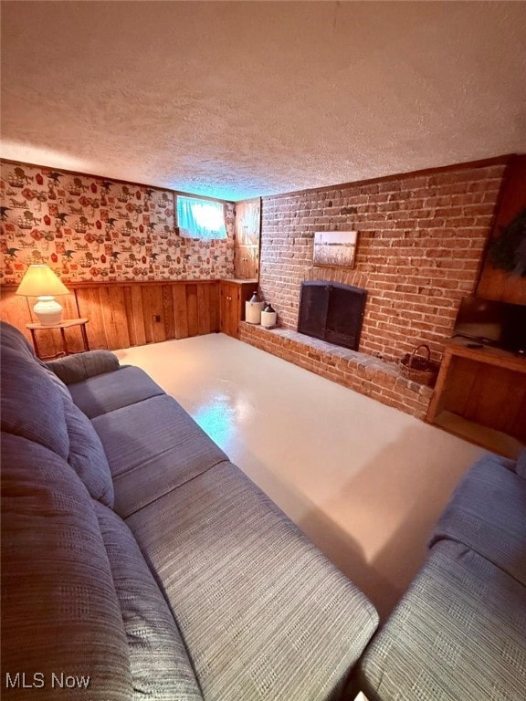 422 Glenwoods Ct, Boardman, OH 44512 - living area featuring a textured ceiling and a fireplace