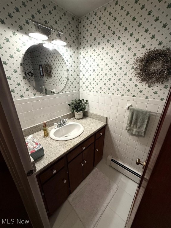 422 Glenwoods Ct, Boardman, OH 44512 - bathroom with baseboard heating, wallpapered walls, a wainscoted wall, tile walls, and vanity