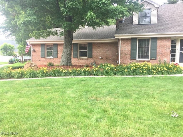 422 Glenwoods Ct, Boardman, OH 44512 - view of front of property featuring brick siding, a front lawn, and a shingled roof