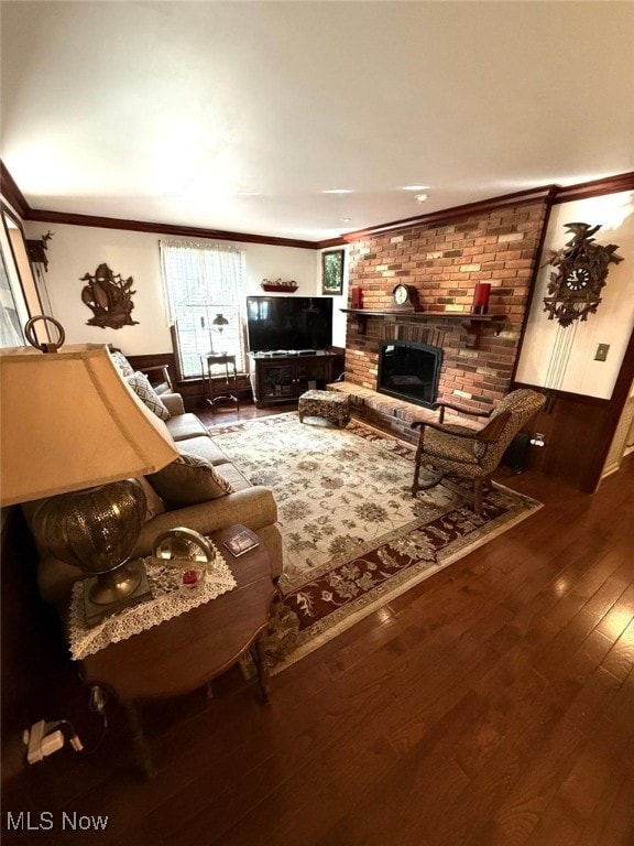 422 Glenwoods Ct, Boardman, OH 44512 - living area with ornamental molding, a fireplace, and hardwood / wood-style floors