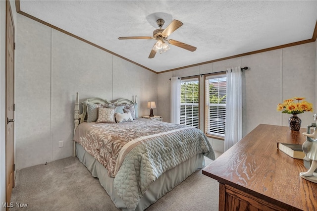 bedroom with a textured ceiling, light colored carpet, ornamental molding, and ceiling fan