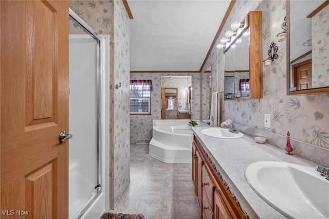 full bath with wallpapered walls, a shower stall, a sink, and a garden tub