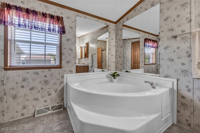 bathroom with visible vents, a healthy amount of sunlight, and wallpapered walls